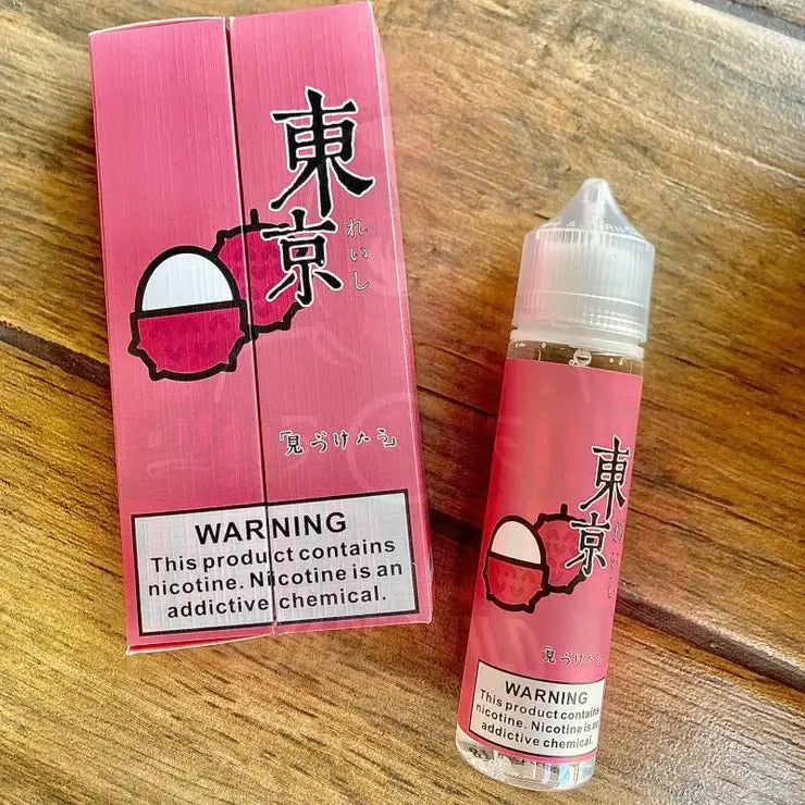 iced litchi by tokyo e-liquid with packaging in wooden background