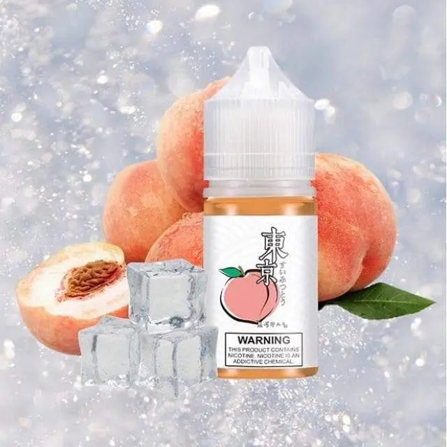 tokyo iced peach saltnic in 30ml bottle with peach fruit display in ice background