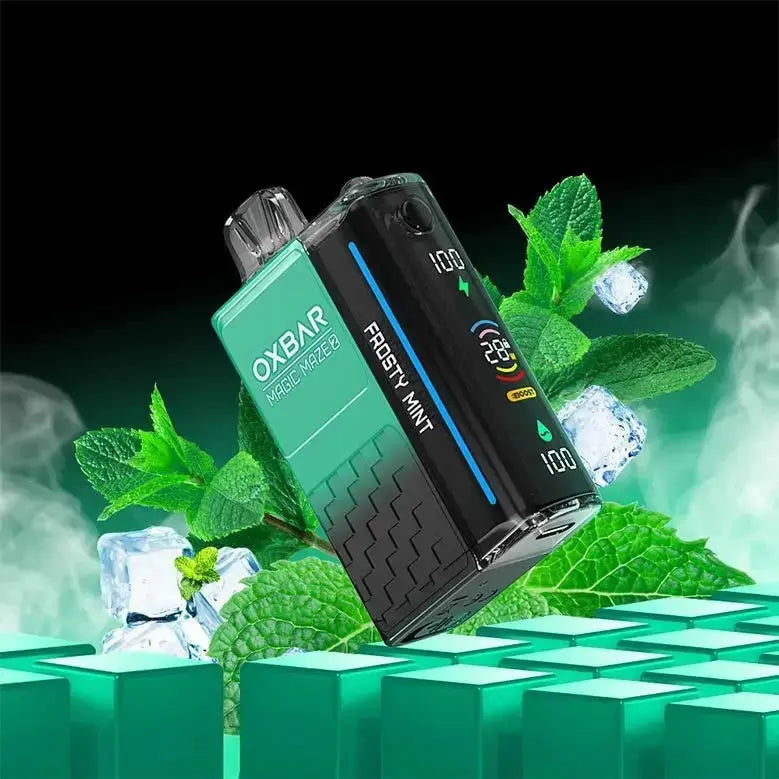 OXBAR vape device with mint leaves and ice cubes on a green and black background. ORDER NOW AND GET FREE DELIVERY!