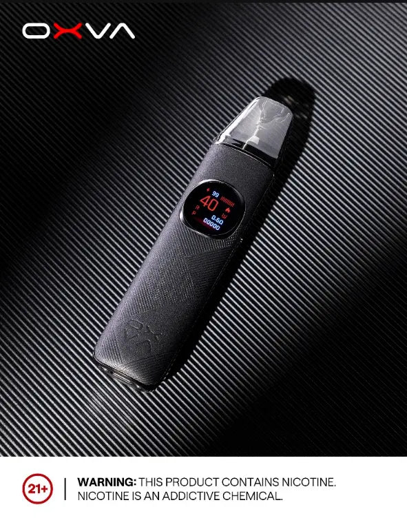 A black OXVA electronic vape device with a digital display, shown diagonally on a dark textured background with a prominent nicotine warning label at the bottom. ORDER NOW AND GET 20% OFF