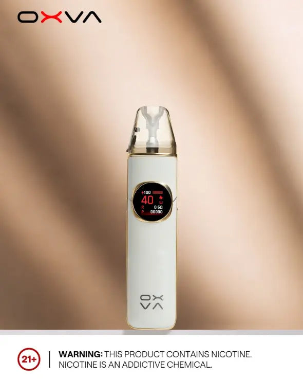 A white OXVA vape device with a clear mouthpiece and a circular digital display, centered on a warm beige background with soft shadows. The OXVA brand logo is visible at the top left, and a nicotine warning label is at the bottom. ORDER NOW AND GET FREE DELIVERY